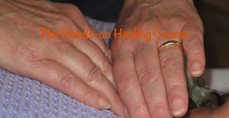image of hands giving reiki treatment
